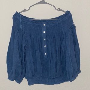 Blue off the shoulder blouse. Only worn a few times. Looks brand new.